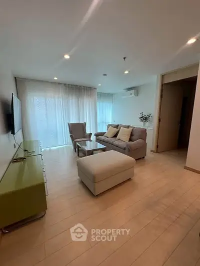 Spacious modern living room with elegant furniture and natural light