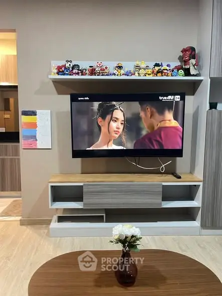 Modern living room with wall-mounted TV and stylish decor