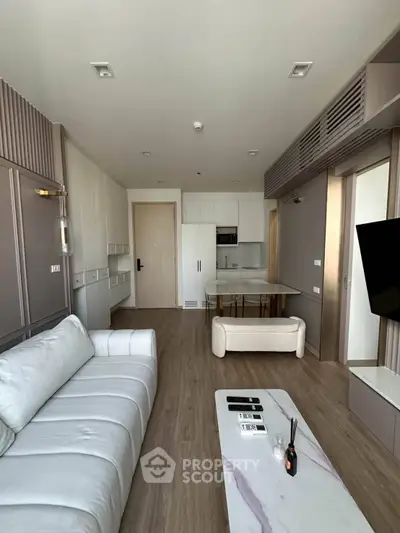 Modern living room with open kitchen and stylish decor