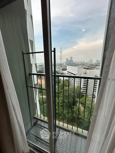 Charming balcony with stunning city view, perfect for relaxation and enjoying the skyline.