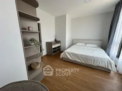 Spacious modern bedroom with elegant decor and natural light