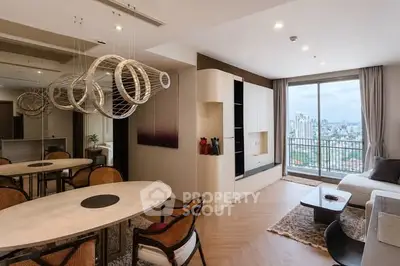 Modern living room with city view, stylish decor, and elegant dining area.