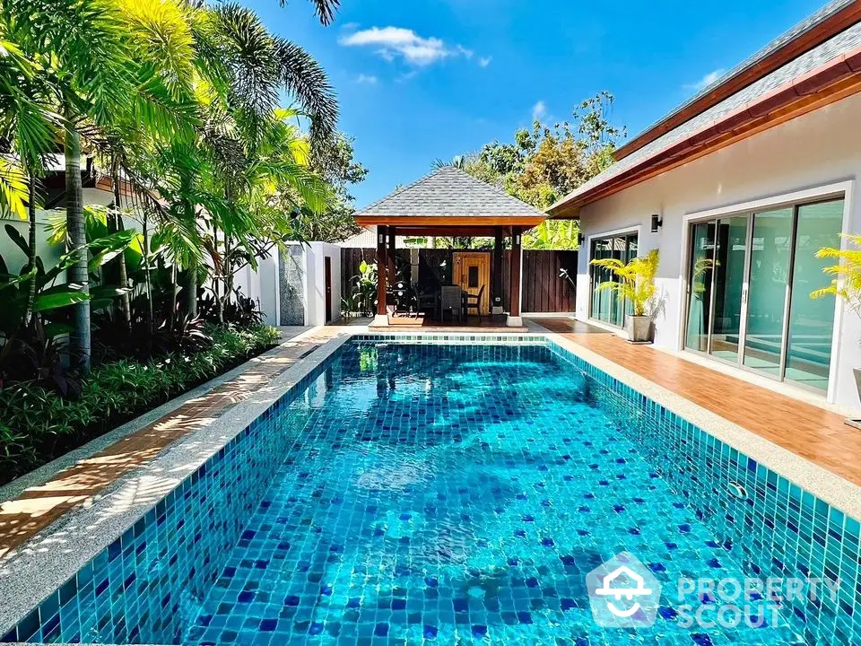 Luxurious villa with private pool and lush garden, perfect for tropical living.