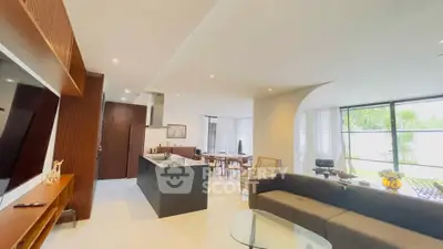 Luxurious open-plan living room with modern kitchen and elegant decor