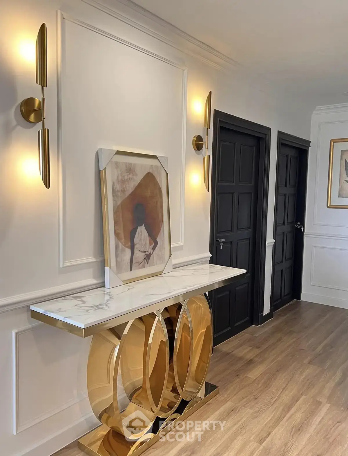 Elegant hallway with modern lighting and stylish decor in a luxury apartment.