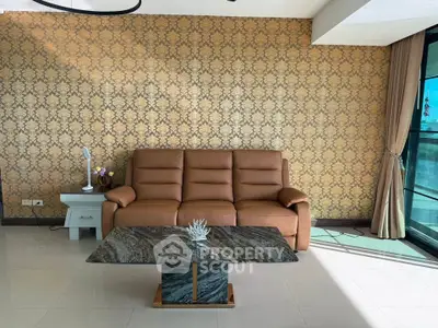 Elegant living room with luxurious leather sofa and stylish marble coffee table, featuring floor-to-ceiling windows.