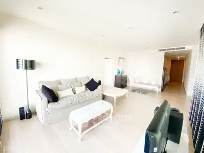 Spacious modern living room with elegant decor and ample natural light