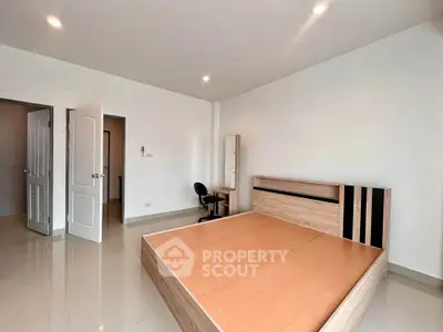 Spacious unfurnished bedroom with modern design and ample natural light