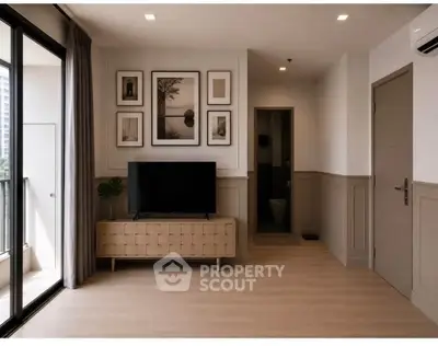 Modern living room with stylish decor and balcony access in a contemporary apartment.