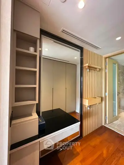 Modern interior with sleek wooden flooring and built-in storage solutions