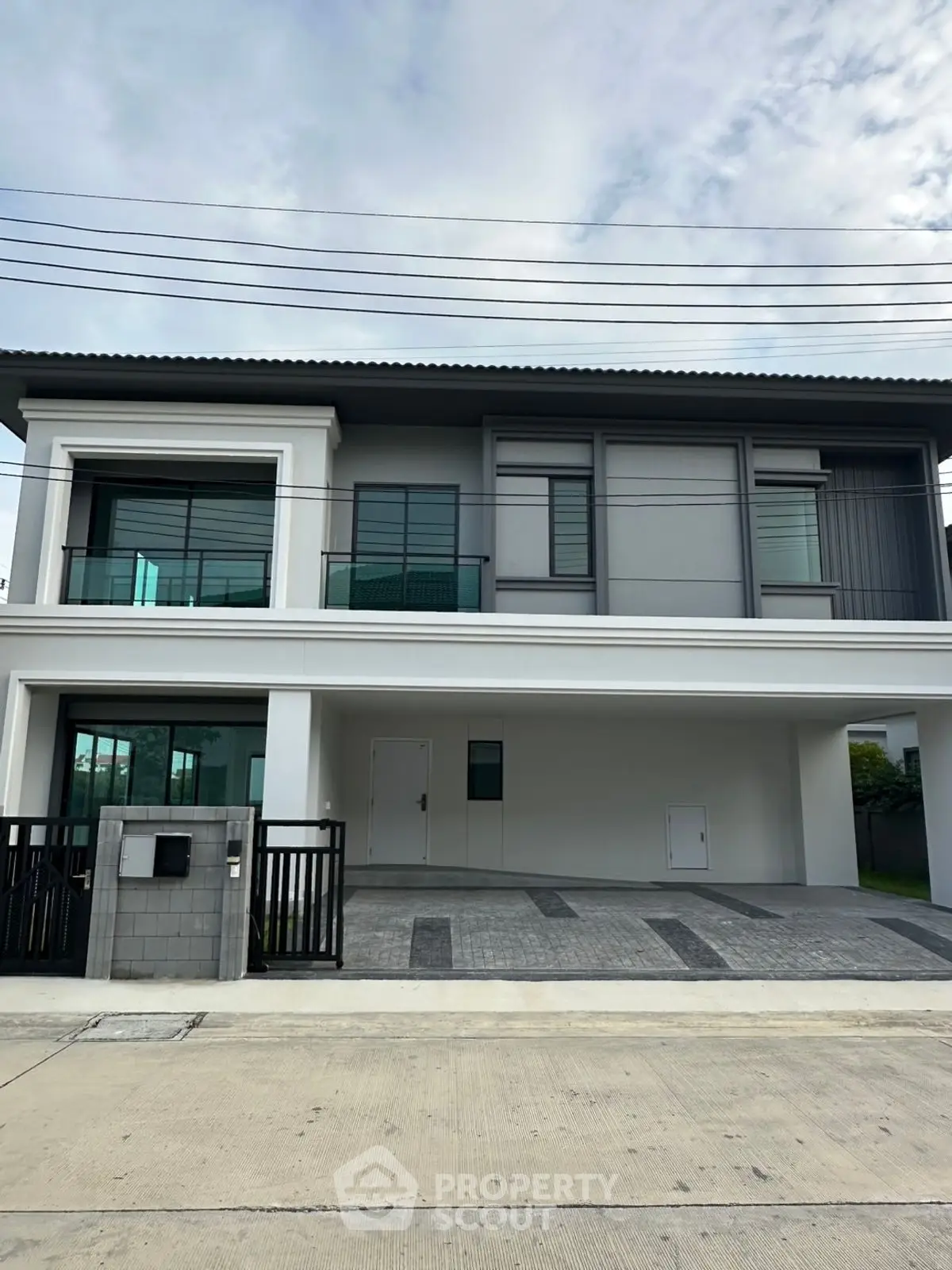 Modern two-story house with sleek design and spacious driveway