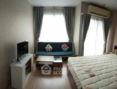 Cozy bedroom with modern decor, featuring a comfortable bed, TV, and stylish sofa.