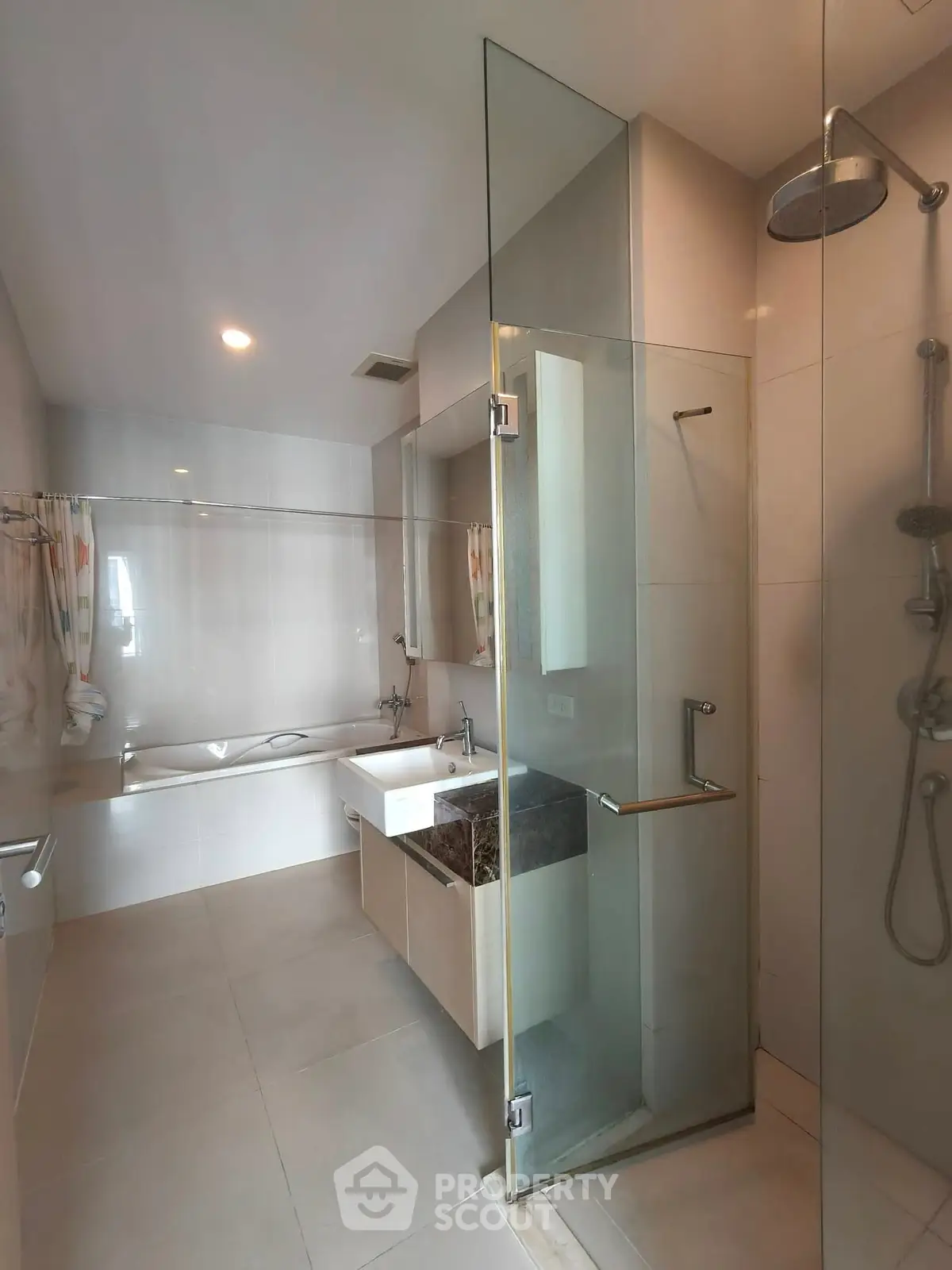 Luxurious modern bathroom with glass shower and bathtub