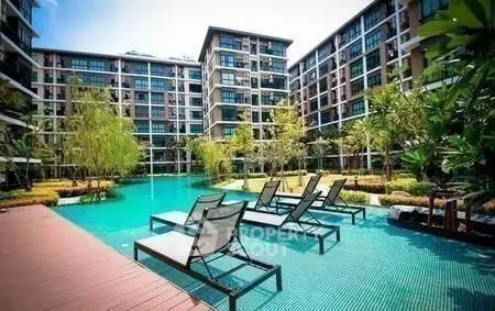 Luxurious apartment complex with stunning pool and lush landscaping