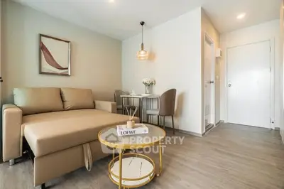 Modern living room with stylish decor and cozy seating area in a contemporary apartment.