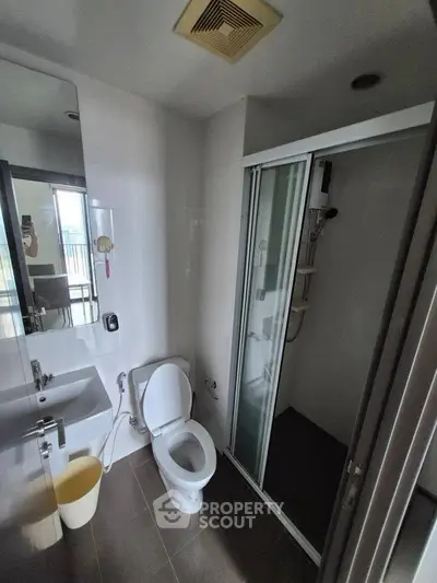 Modern bathroom with shower and toilet in sleek design