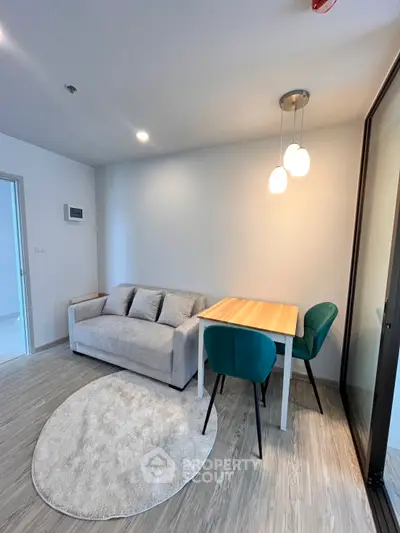 Modern living room with cozy sofa and dining area in stylish apartment