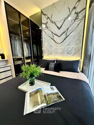 Luxurious bedroom with elegant marble accent wall and stylish wardrobe