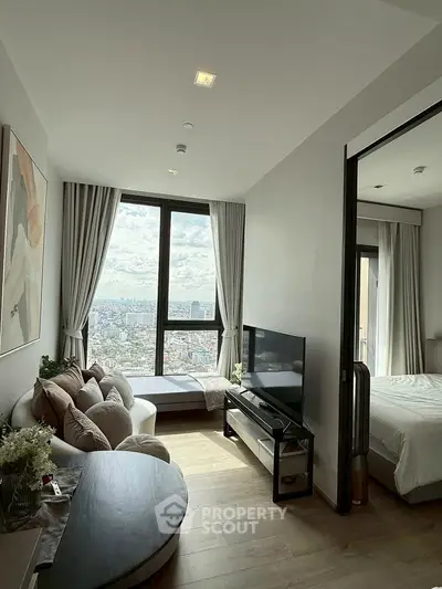 Modern living room with stunning city view and cozy seating area