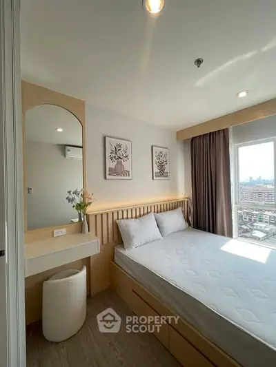 Modern bedroom with city view, featuring minimalist decor and natural light.