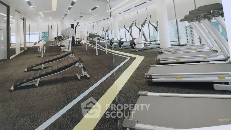 Modern gym with state-of-the-art fitness equipment and panoramic city views.