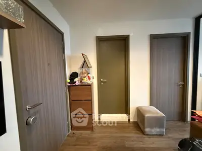 Modern apartment hallway with wooden doors and stylish decor