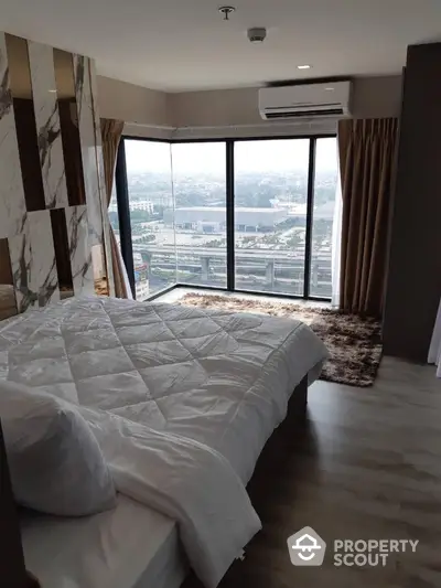 Luxurious bedroom with panoramic city view and modern decor