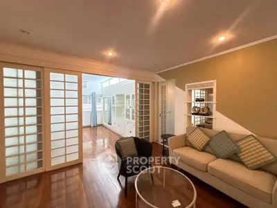 Spacious living room with elegant sliding doors and cozy seating area