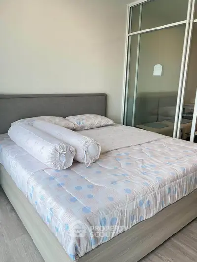 Cozy bedroom with modern decor and large bed in a stylish apartment.