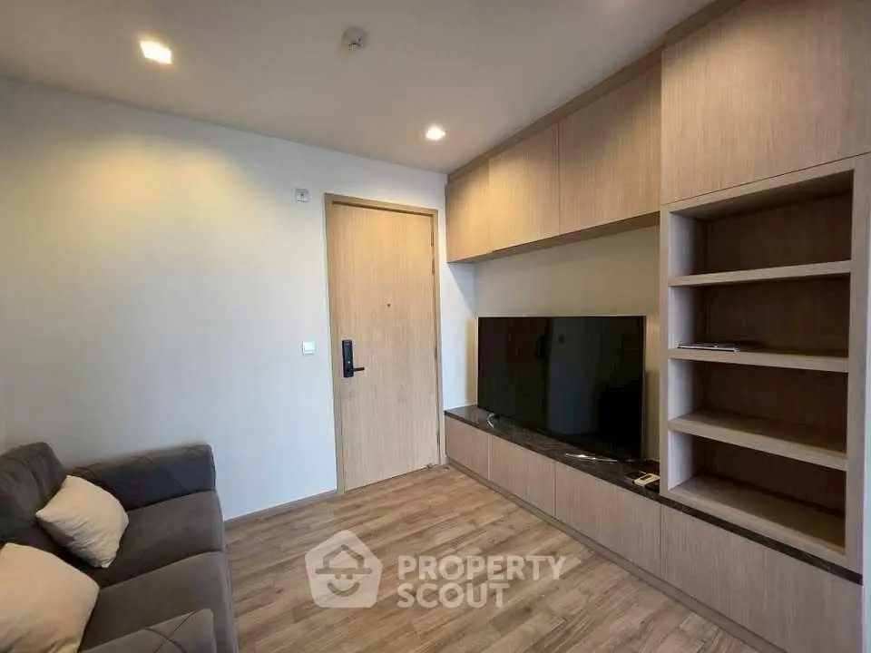 Modern living room with built-in wooden shelves and cozy sofa