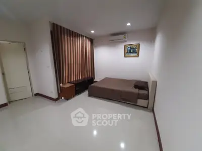 Spacious bedroom with modern decor and air conditioning