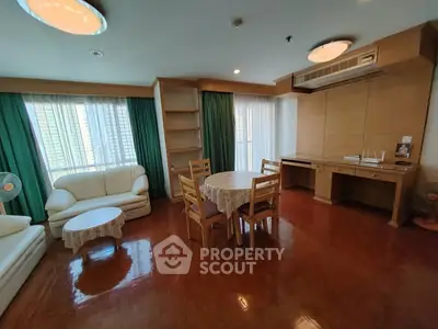 Spacious living room with elegant wooden flooring and natural light
