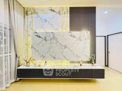 Luxurious modern interior with marble accent wall and elegant decor