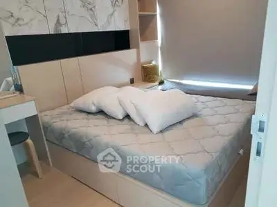 Cozy bedroom with modern decor and comfortable bedding