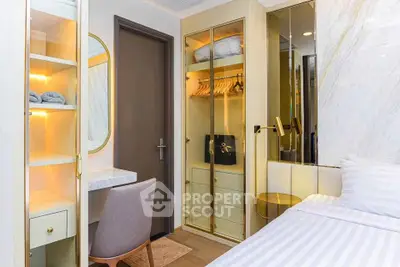 Stylish bedroom with modern furniture and built-in wardrobe, perfect for urban living.