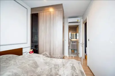 Modern bedroom with cozy decor and ensuite bathroom