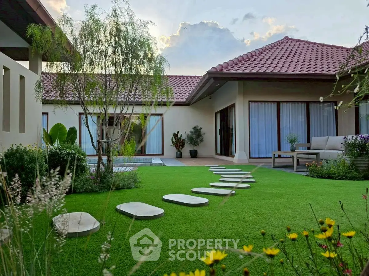 Charming garden view of a modern house with lush greenery and stylish architecture, perfect for serene living.