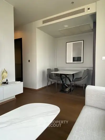 Modern living room with elegant dining area and stylish decor