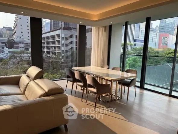 Luxurious corner unit with panoramic city views and elegant dining area in a modern living room.