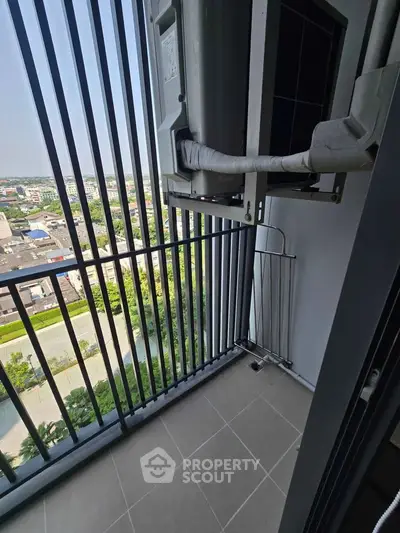 Modern balcony with city view and air conditioning unit, perfect for urban living.
