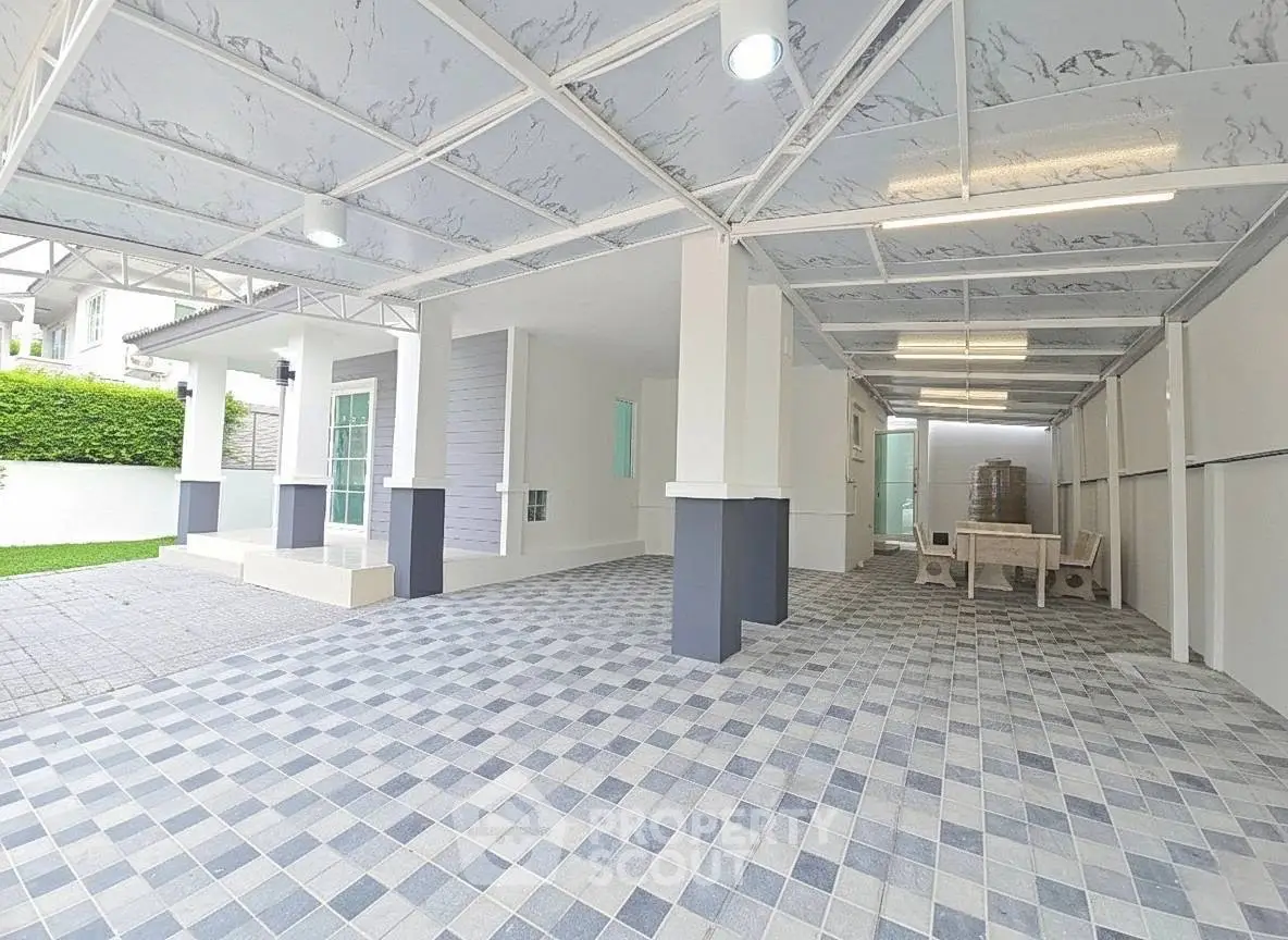 Spacious covered parking area with modern design and tiled flooring