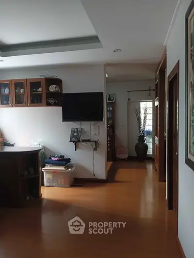 Spacious living area with wooden flooring and modern decor