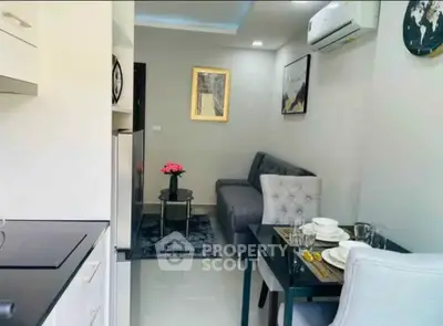 Modern living room with dining area and air conditioning in stylish apartment