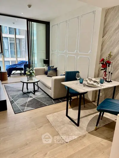 Modern living room with stylish decor and dining area in open layout apartment.
