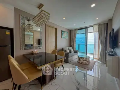 Luxurious living room with ocean view, elegant decor, and modern furnishings.