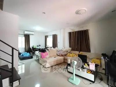 Spacious living room with modern furniture and natural light