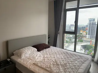 Modern bedroom with large window offering stunning city view, featuring a cozy bed and minimalist decor.