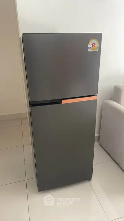 Modern stainless steel refrigerator in sleek kitchen setting