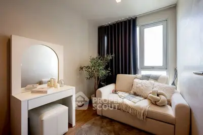 Cozy and stylish small living room with modern decor and natural light.