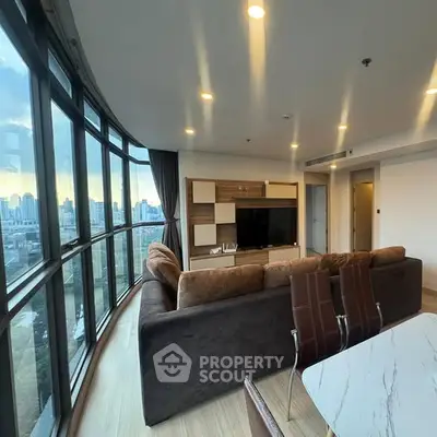 Spacious living room with panoramic city view and modern furnishings